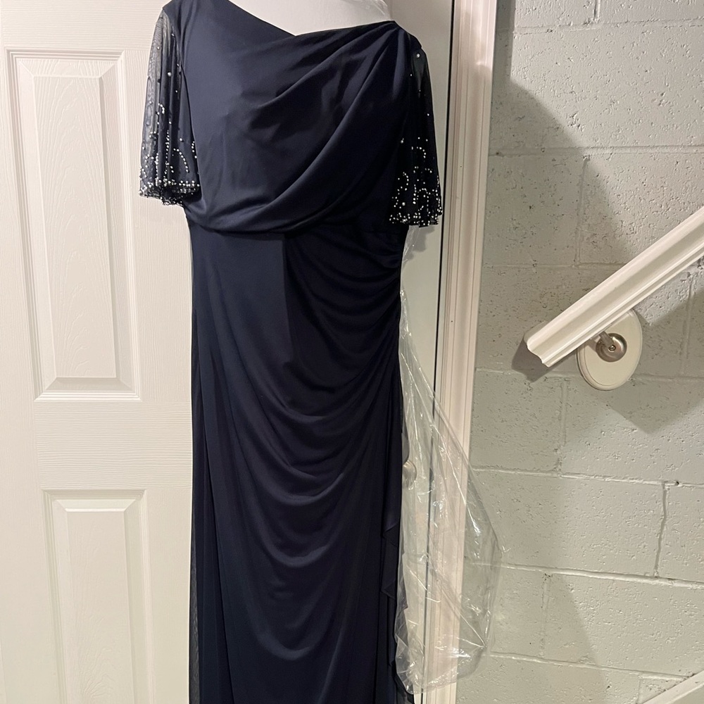 Betsy and Adam size 16w dark navy gown. Short sleeve with elegant beading.
